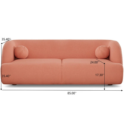 The Anna - French Boucle Sofa is a modern, peach-colored piece with two round cushions, measuring 85" wide, 35.4" high/deep, a seat height of 17.3", and a seat depth of 24".