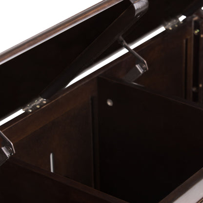 A close-up view of the Connaught Handcrafted Storage Bench Trunk, featuring an open dark wooden chest with a hinged lid and a spacious, compartmentalized interior.