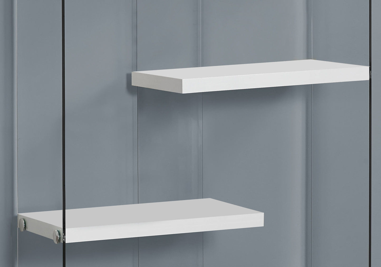 A glossy white contemporary 5-tier bookshelf stands against a smooth gray wall, showcasing a minimal and modern aesthetic with ample space between each tier.