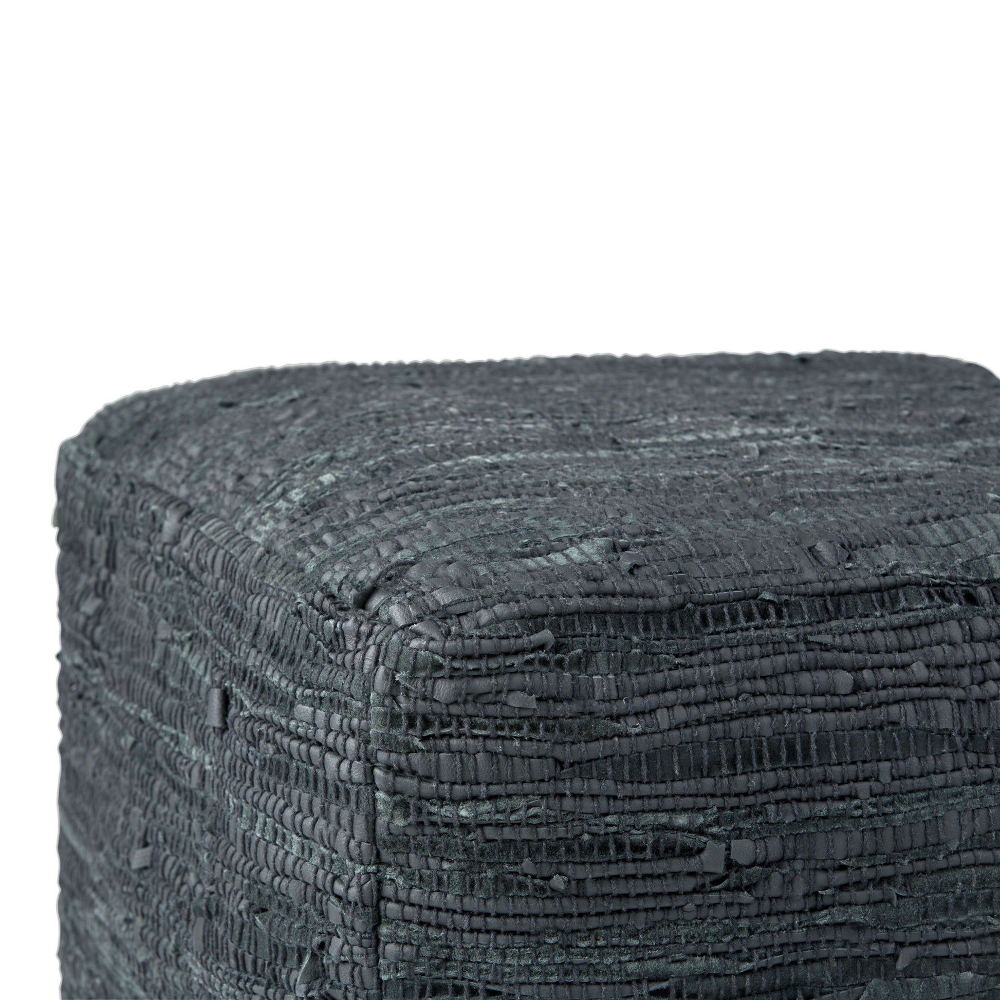 Close-up of the top and sides of the Fredrik Handcrafted Square Pouf, featuring a textured, dark gray surface with a rough, woven layered pattern.