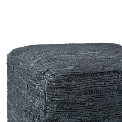 Close-up of the top and sides of the Fredrik Handcrafted Square Pouf, featuring a textured, dark gray surface with a rough, woven layered pattern.