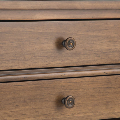 Close-up of two drawers on the Carlton Bedside Table in Rustic Natural Aged Brown, each featuring a round dark metal knob and natural wood grain patterns.
