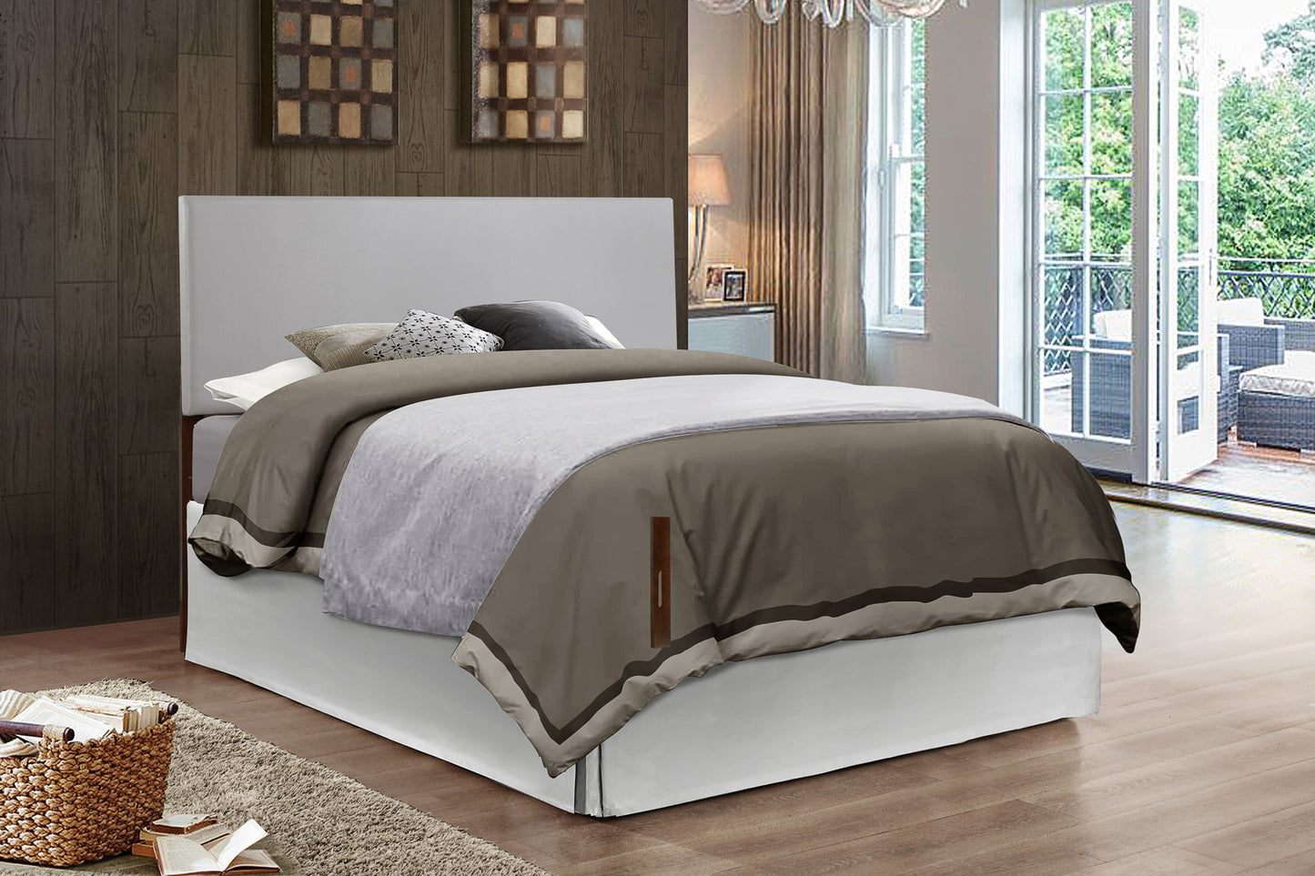 A modern bedroom features the Nova Headboard on a neatly made bed with gray and beige bedding, wood-paneled walls, large windows, a light rug, a basket of books, and patio furniture visible through glass doors.