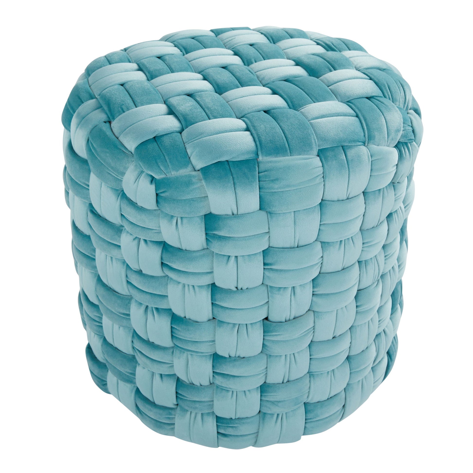 The Braided - Versatile Round Ottoman features a chunky, woven design in soft light blue velvet, creating a plush and cushiony look. Photographed against a white background.
