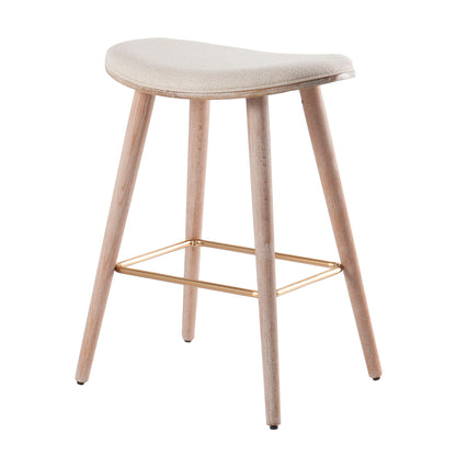 The Saddle - Contemporary Counter Stool (Set of 2) features a curved upholstered beige seat, four light wood legs, and a rectangular gold footrest connecting the legs near the base.