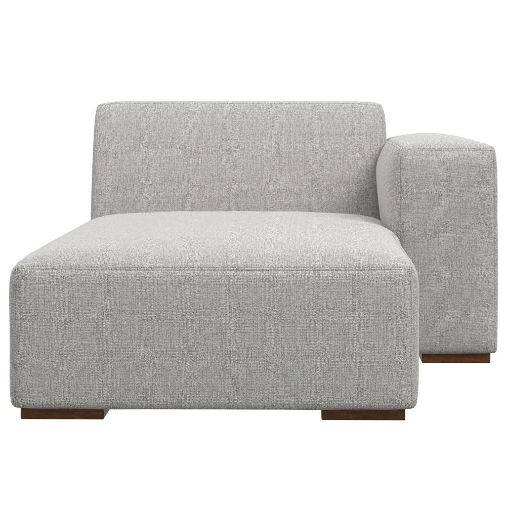 The Rex - Right Chaise Sofa Module in gray features modern light gray upholstery, a low backrest, a right-side single armrest, and short wooden block feet.