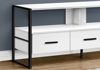 A modern TV Stand Console with two storage drawers, black metal legs and handles, sits against a gray wall on a wooden floor.