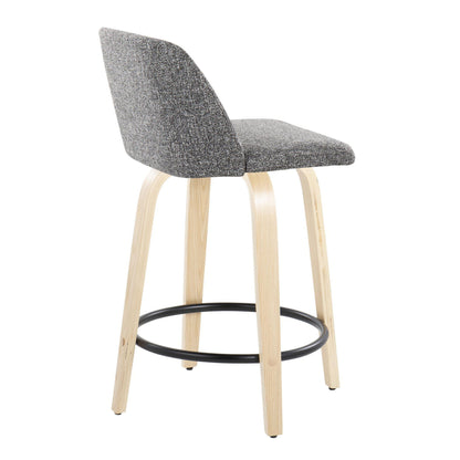 The Toriano Counter Stool features a curved gray upholstered backrest and seat with light wooden legs, a round black footrest, and is slightly angled to the right.