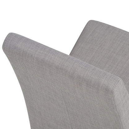 Close-up view of the backrests of two Acadian Upholstered Parson Dining Chairs in light gray fabric, highlighting their simple, clean lines and soft texture against a white background.