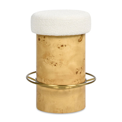 The Nebula Backless Round Upholstered Counter Stool With Burl in Ivory White features a cylindrical light wood base, brass ring footrest, and a round ivory white textured cushion.