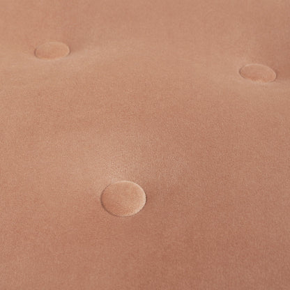 Close-up of the Yolanda Round Upholstered Accent Ottoman's soft, light brown tufted fabric surface with four evenly spaced, indented buttons.