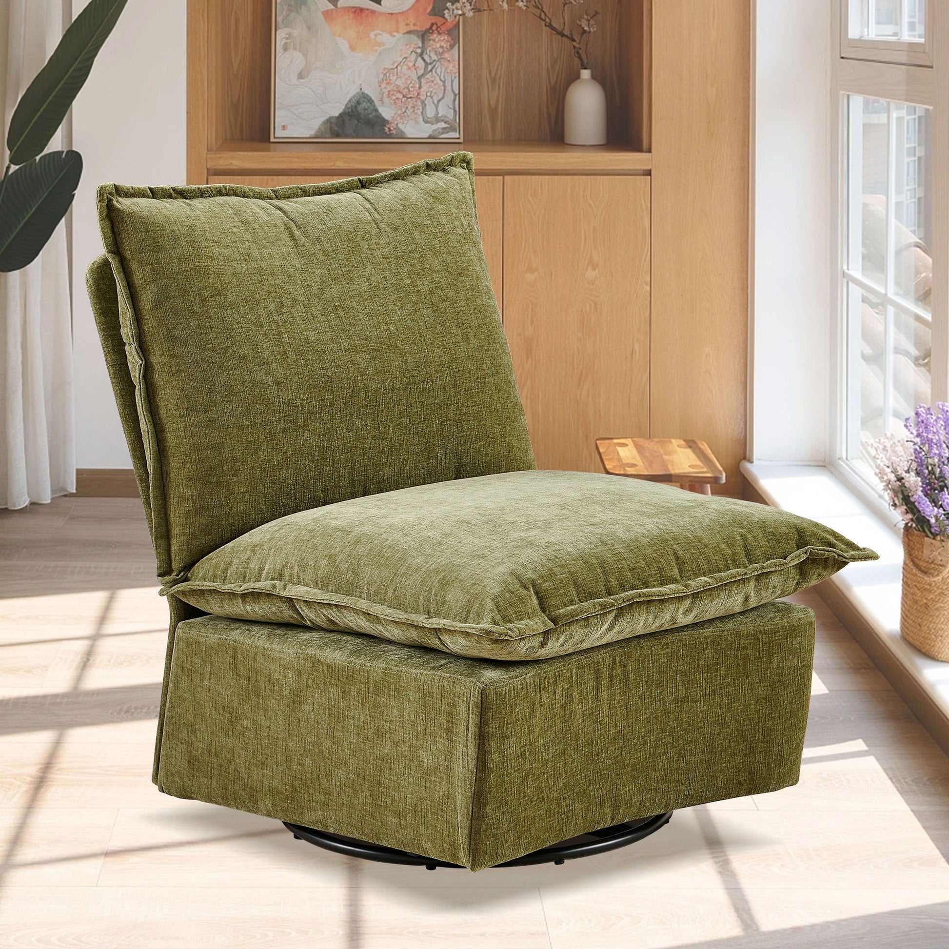 The Detachable Chenille Single 360 Swivel Rocking Rocker, a modern fabric swivel chair with plush cushions, is featured in a bright room with wood floors, large windows, and wooden shelves decorated with books and plants.