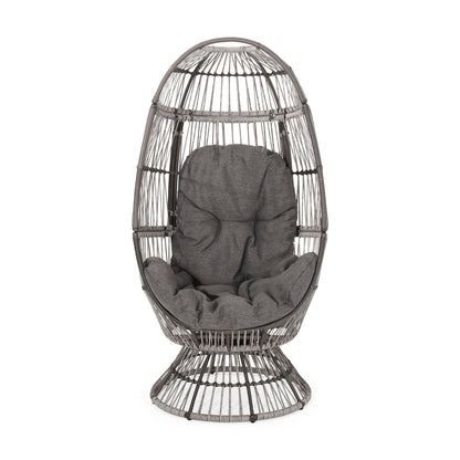 The Patio Swivel Basket Egg Chair With Cushion features a modern, open-frame rattan design with an egg shape and includes a plush gray cushion for comfortable seating and back support.