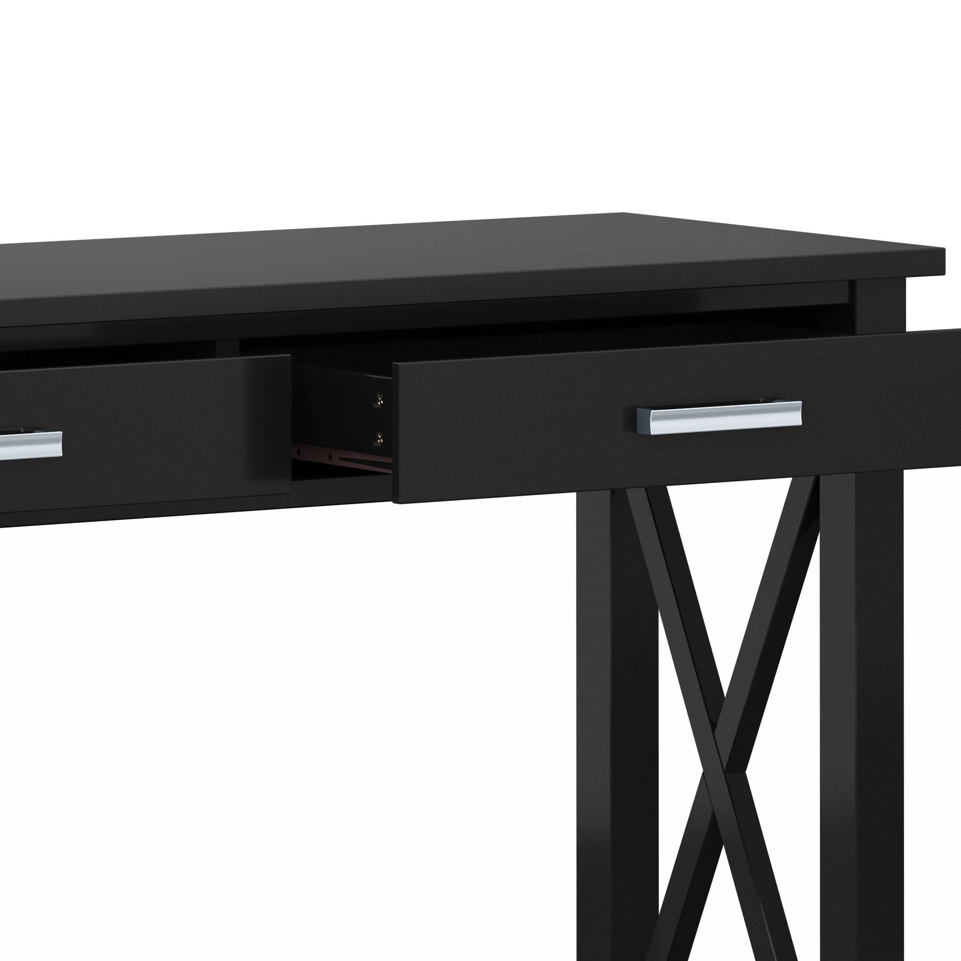 A close-up of the Kitchener - Handcrafted Table, a modern black desk with a partially open center drawer, sleek metal handles, and X-shaped side supports.