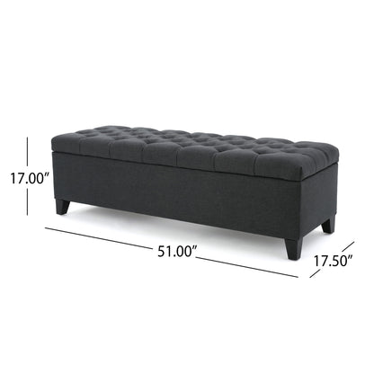 The Glouster – Contemporary Storage Ottoman features a dark gray button-tufted design, short black legs, and measures 51"W x 17.5"D x 17"H.