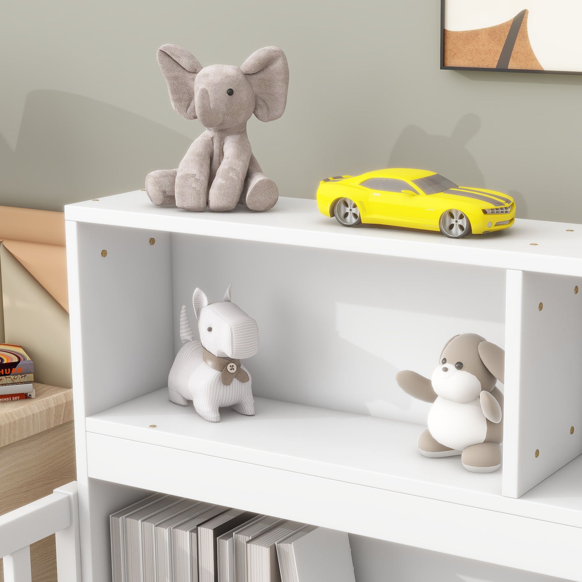 A Floor Bed With Bedside Bookcase featuring a white shelf with a gray plush elephant and yellow toy car on top, a striped plush dog and brown-and-white plush toy on the middle shelf, and books neatly arranged below.