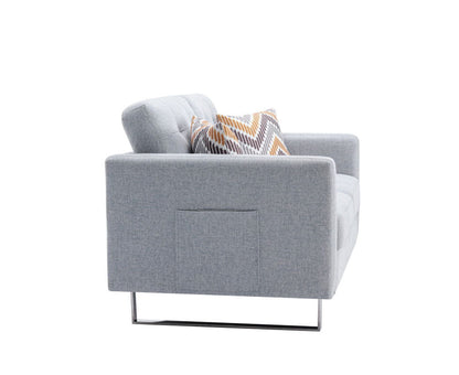 The Victoria Linen Fabric Loveseat features modern metal legs, handy side pockets, and includes decorative zigzag yellow, gray, and white pillows. Photographed from the side on a white background.