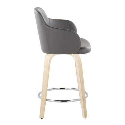Side view of the Boyne - Contemporary Fixed Height Counter Stool & Swivel (Set of 2) featuring a gray cushioned seat and backrest, light wood legs, and a round chrome footrest.