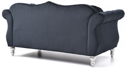 The Stylish Flared Arm Loveseat features dark blue velvet, rolled arms, a curved backrest, and short shiny silver legs, shown from the back against a white background.
