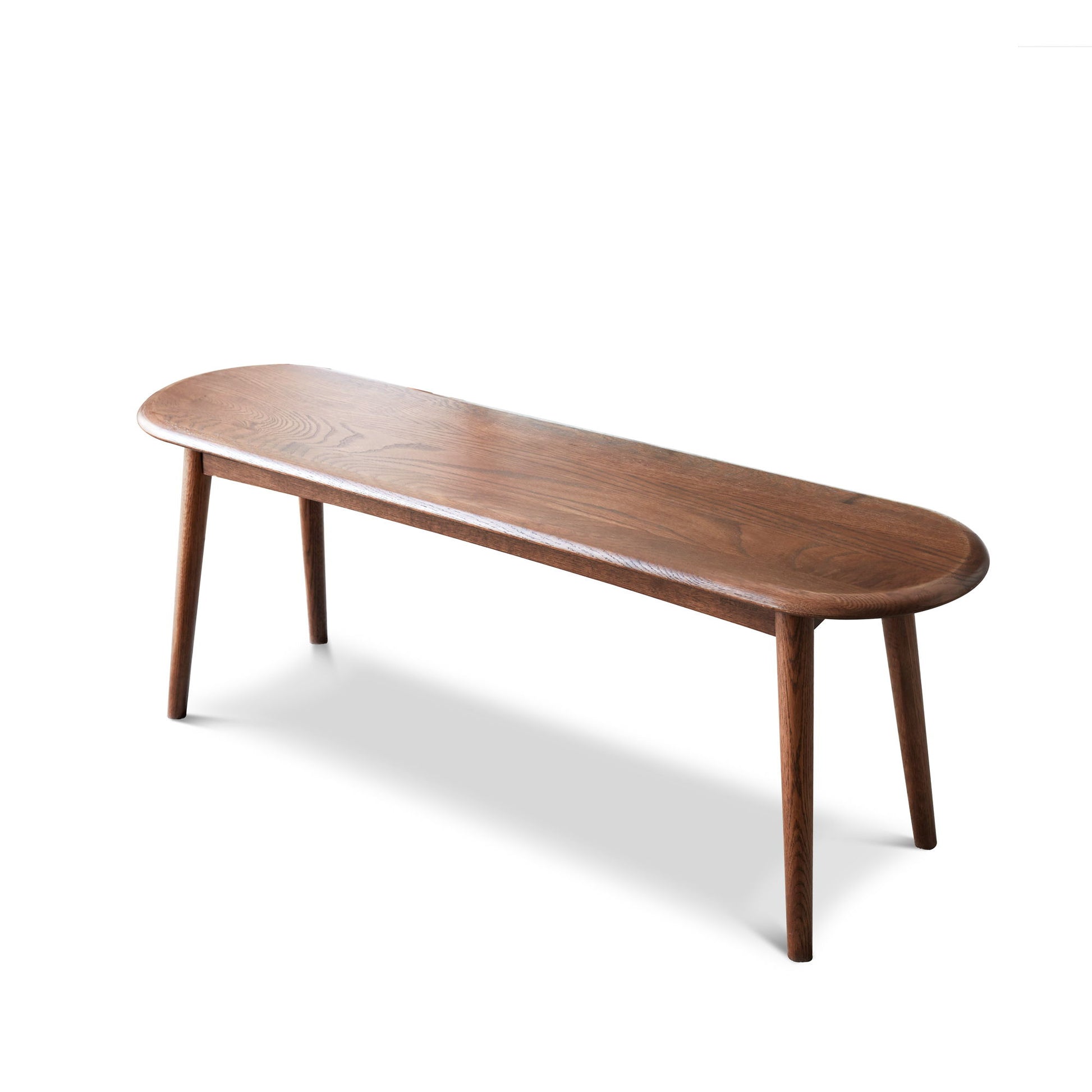 The Dining Bench features an oval top and four angled legs with a smooth, polished finish. This Table Bench for Living Room is showcased against a plain white background.