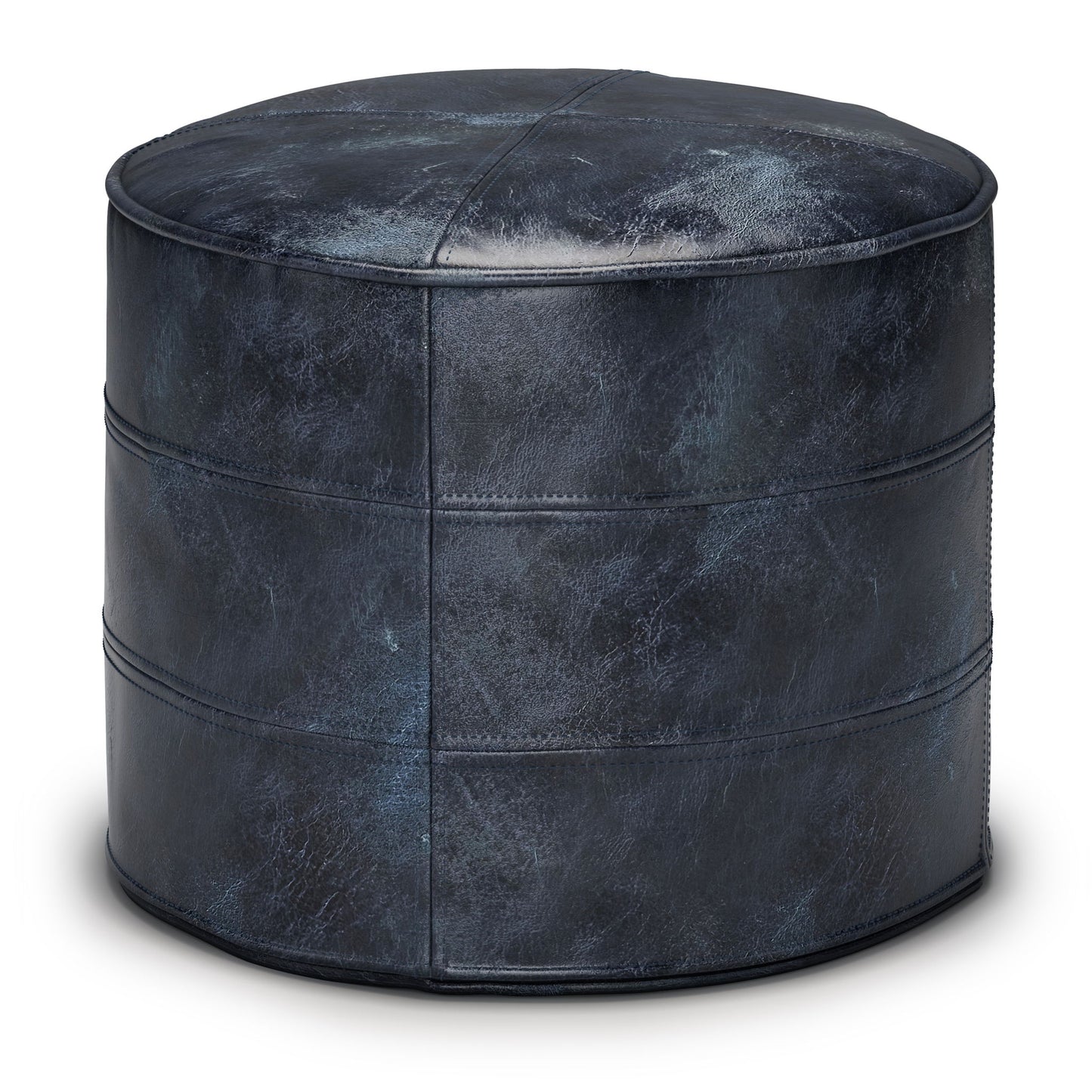 The Connor - Handcrafted Round Pouf is a dark blue leather ottoman with visible stitching and a slightly distressed finish, displayed against a white background.