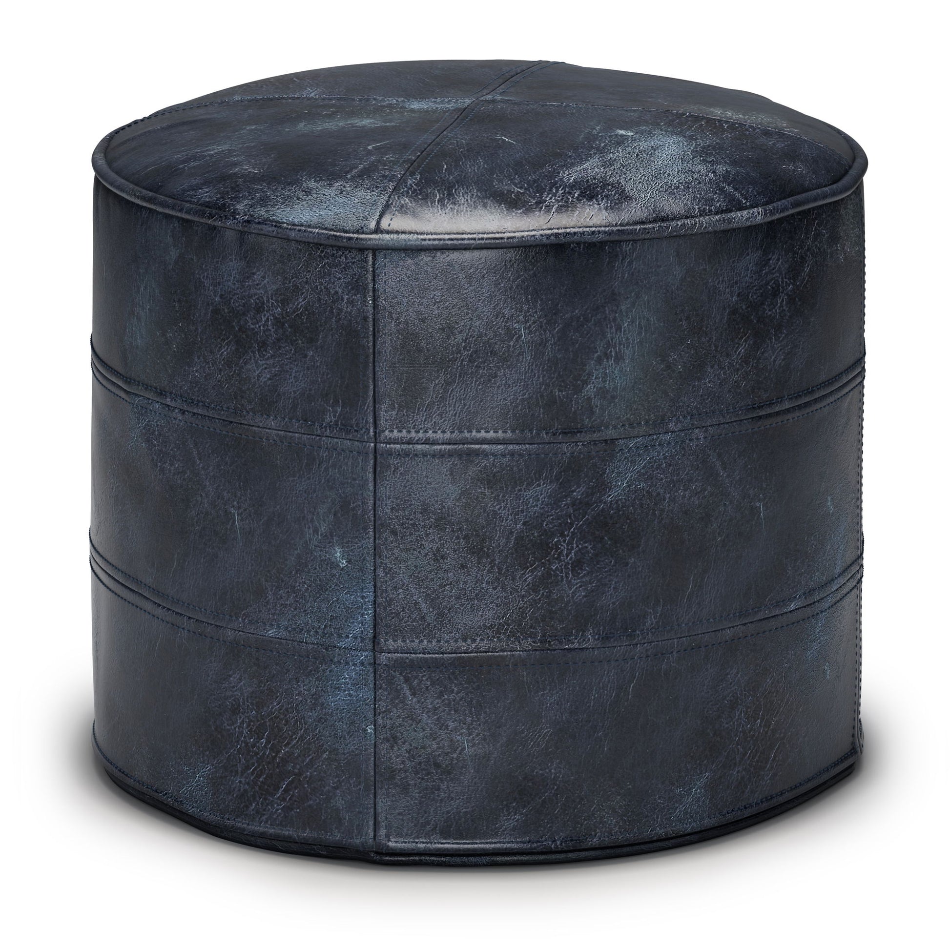 The Connor - Handcrafted Round Pouf is a dark blue leather ottoman with visible stitching and a slightly distressed finish, displayed against a white background.
