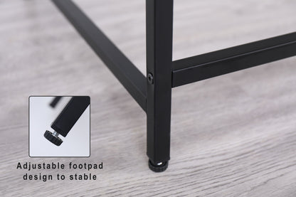 Close-up of the black Console Table's metal leg with an adjustable footpad on a light wood floor. An inset highlights the footpad with text: "Adjustable footpad design for stability.