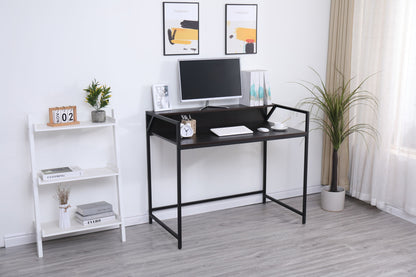 A modern, minimal home office features the Console Table Narrow Modern Entryway Table in black as a sleek desk with a monitor, keyboard, books, potted plants, and decor on a white shelving unit to the side. Sheer curtains let in natural light.