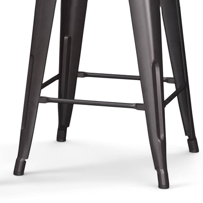 Close-up of the metal legs and footrest of the Rayne Multifunctional Metal Stool in a dark gray finish, set against a white background.