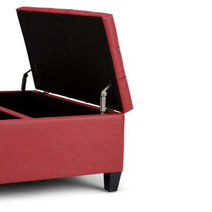 The Harrison Upholstered Coffee Table Storage Ottoman, shown in red with its cushioned lid open to reveal an empty interior, features dark wooden legs and is set against a white background.