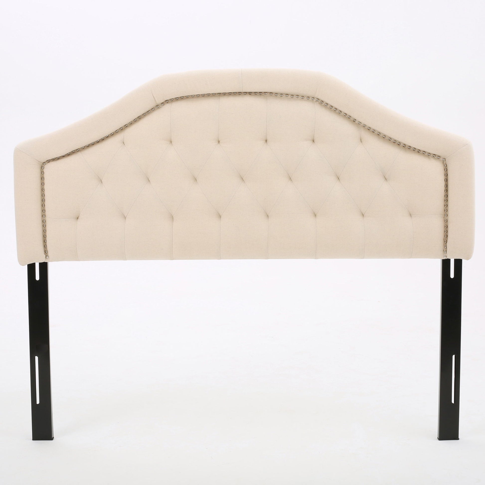 The Queen & Full Size Headboard With Diamond Tufting And Nailhead Trim in beige features a tufted diamond pattern, decorative nailhead trim, and is supported by two black metal legs, shown against a plain white background.