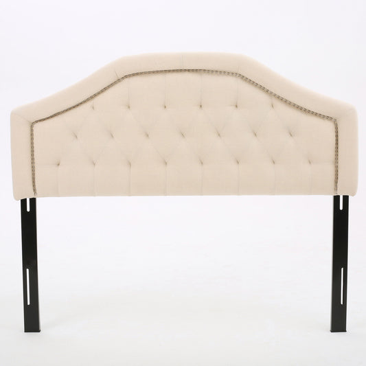 The Queen & Full Size Headboard With Diamond Tufting And Nailhead Trim in beige features a tufted diamond pattern, decorative nailhead trim, and is supported by two black metal legs, shown against a plain white background.