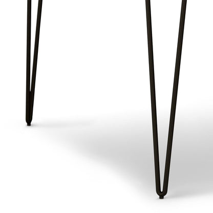 Close-up of two black metal hairpin legs from the Hunter - Square Tabletop Dining Table on a white background. The thin, angled legs cast soft shadows on the surface.