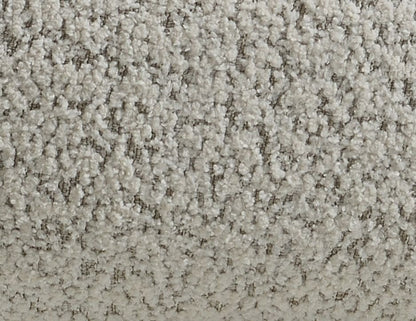 Close-up of the Irma Chair With Swivel in gray, highlighting its soft, textured fabric with a fleecy feel and subtly patterned, light gray and white surface.