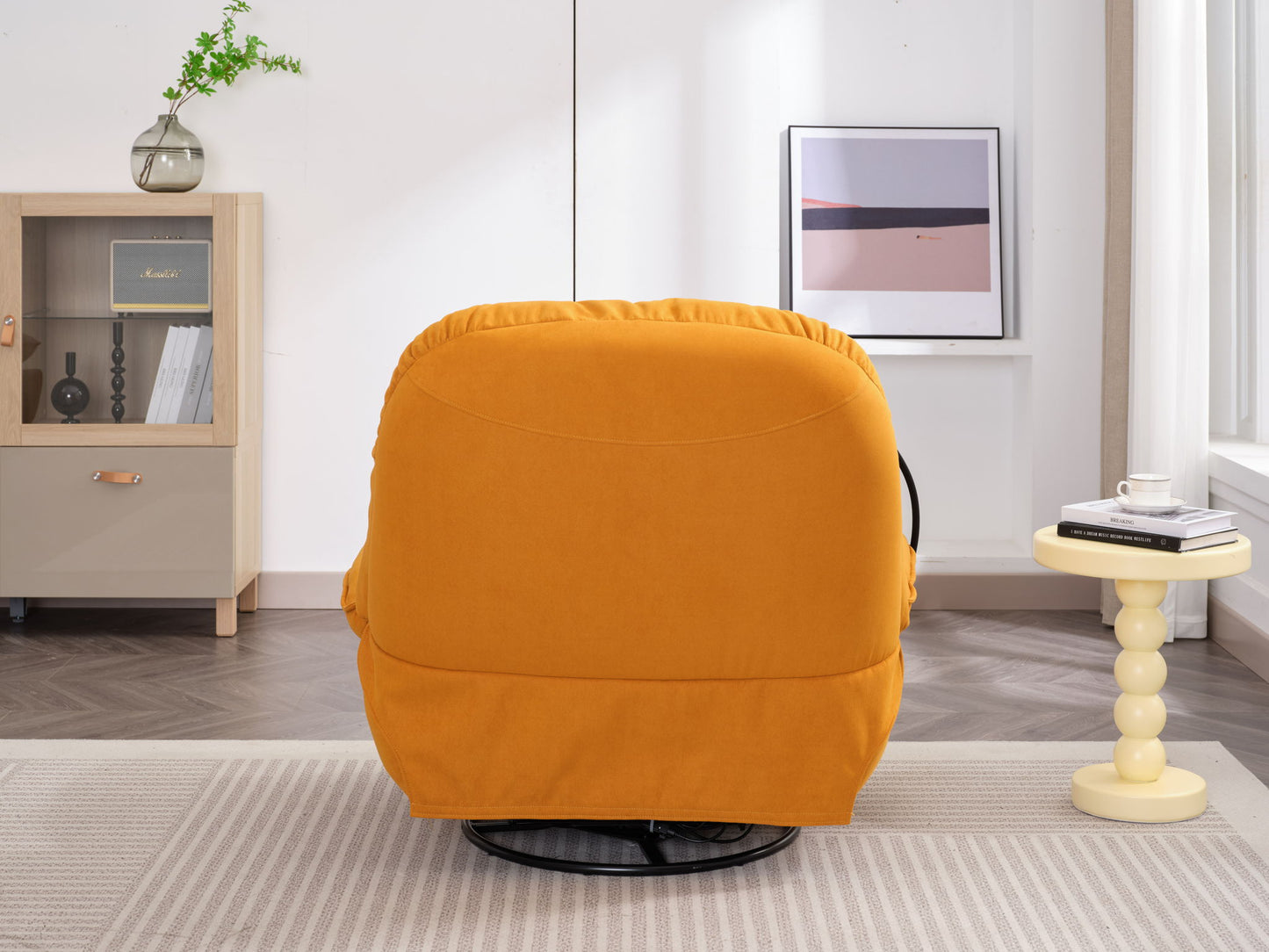 A Power Recliner Swivel Glider with USB charger and Bluetooth music player sits in a modern living room with a beige rug, yellow side table, cabinet, small plant, and framed artwork. Sunlight pours through the large window.