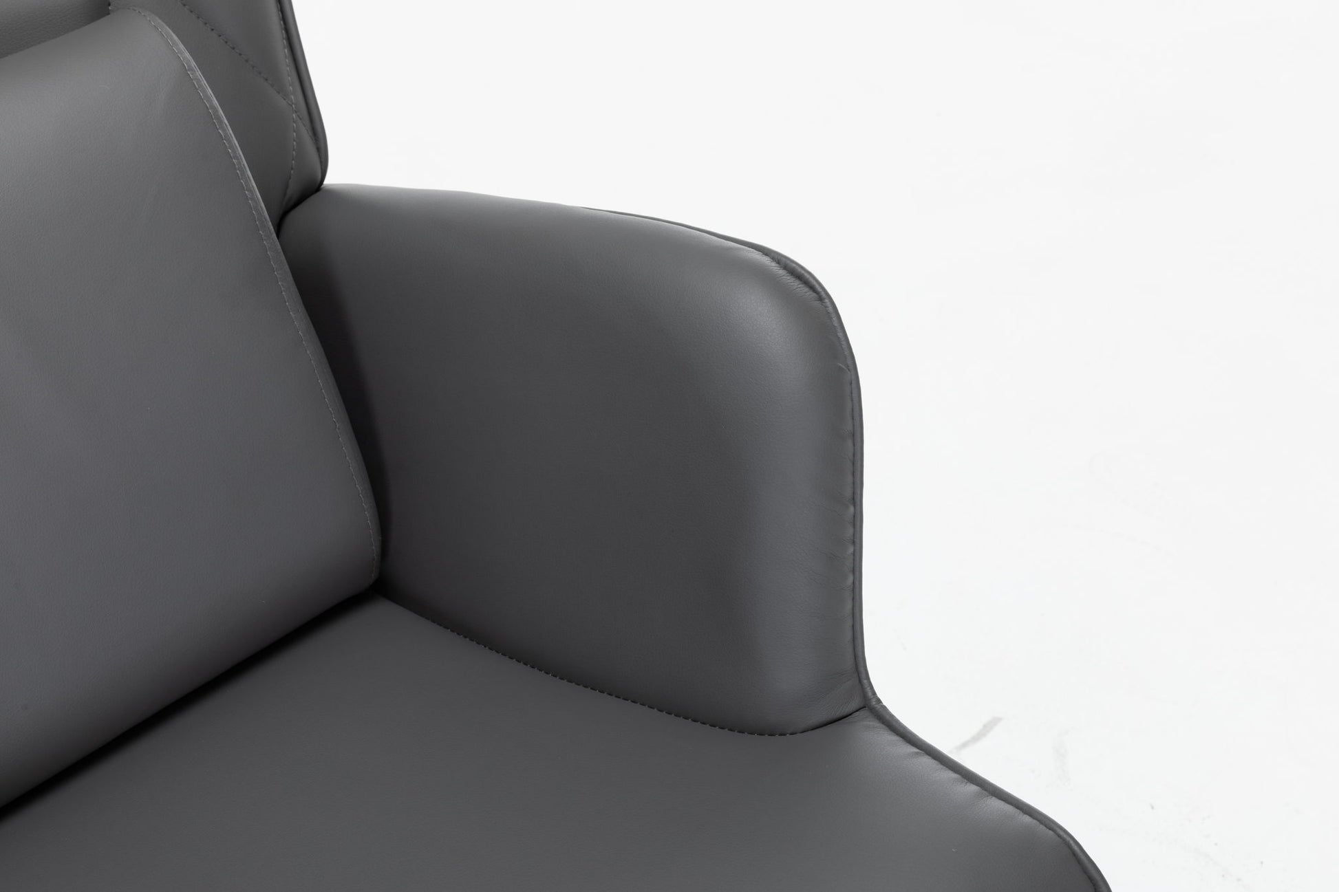 Close-up of the Rocking Accent Chair With Lumbar Pillow And Ottoman featuring dark gray upholstery, smooth curved armrests, and backrest, set against a white background.