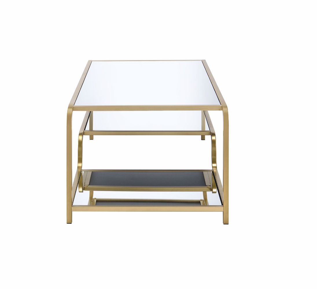 The Astrid - Mirrored Table features a rectangular design with a gold metal frame, clear glass top, and black lower shelf, shown against a white background.