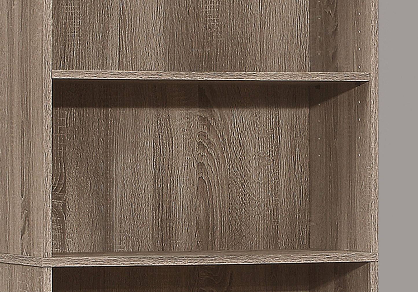 A close-up of the 6 Tier Bookshelf (Bookcase, Transitional) for office use, featuring light brown weathered wood with visible grain patterns. The empty shelves are shown against a plain gray background.