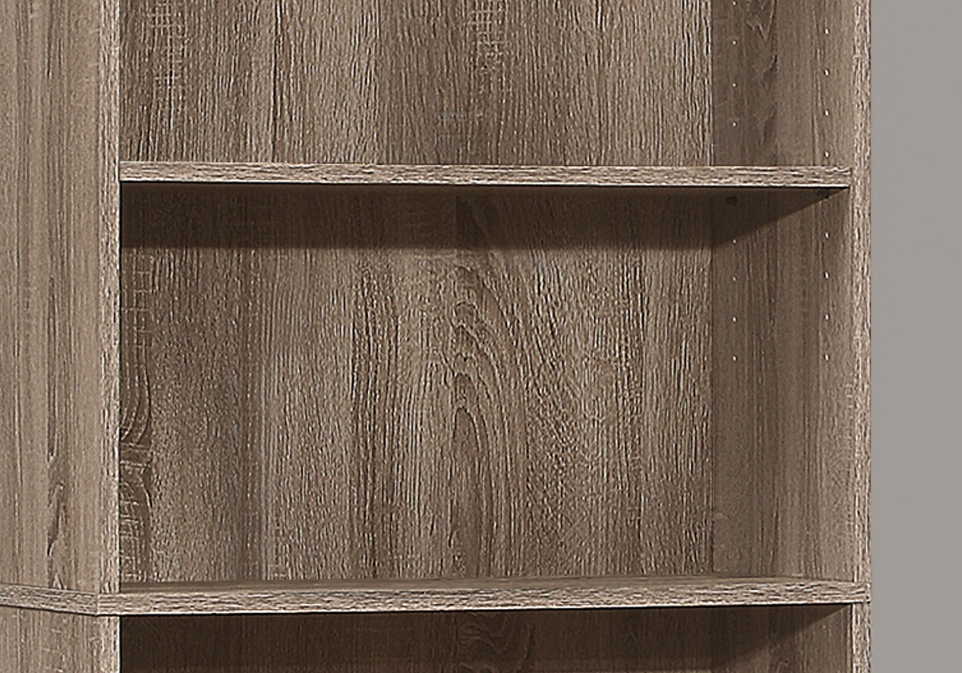 A close-up of the 6 Tier Bookshelf (Bookcase, Transitional) for office use, featuring light brown weathered wood with visible grain patterns. The empty shelves are shown against a plain gray background.