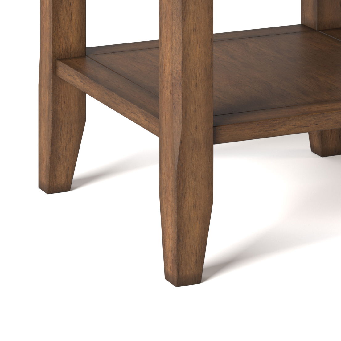 Close-up of the lower section of the Acadian - Transitional End Table, highlighting its legs and bottom shelf with a smooth brown finish against a white background.