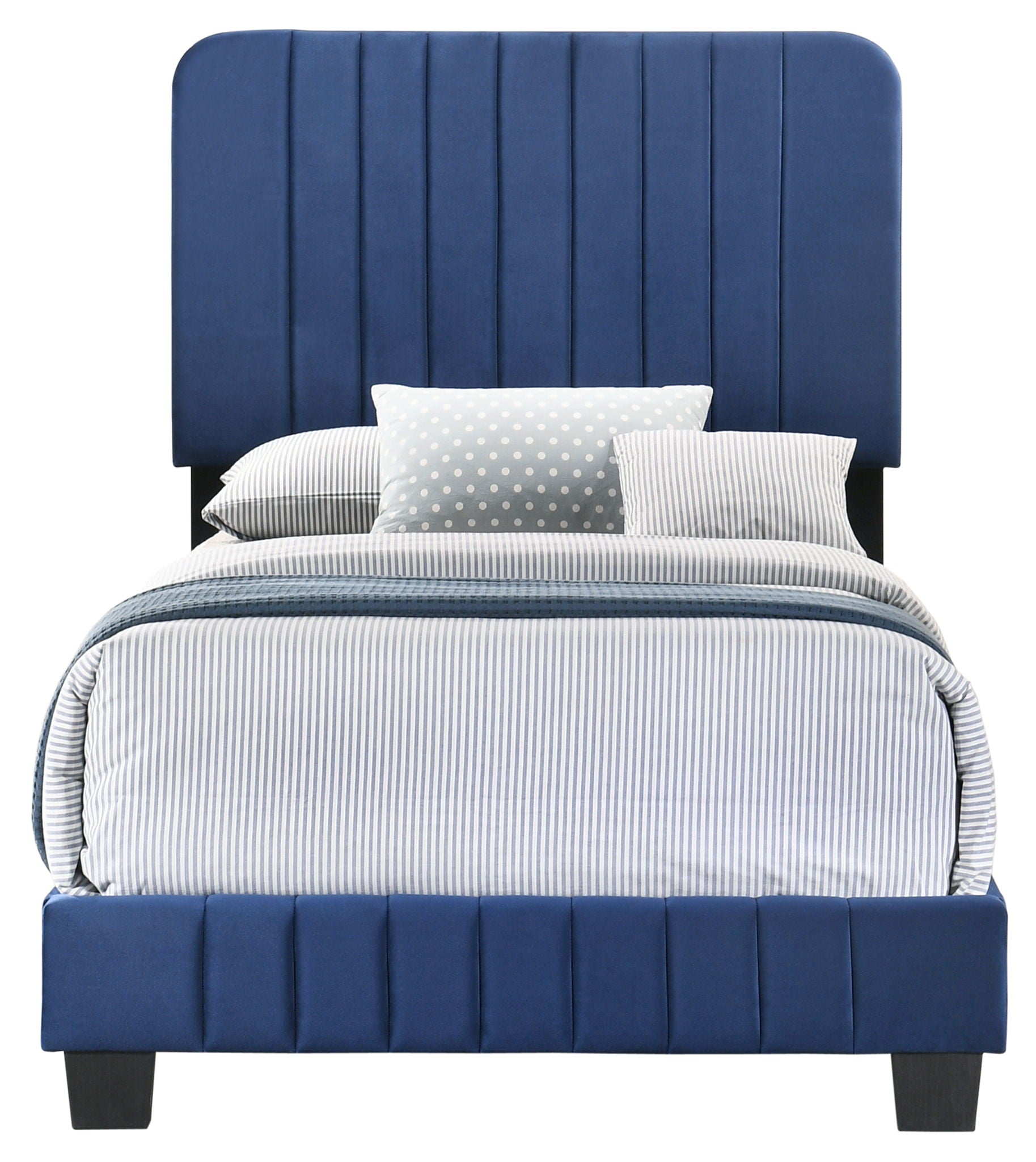 Front view of the Lodi - Bed, featuring a tall royal blue vertical-panel upholstered headboard. The bed is made with light blue and white striped bedding and pillows, plus a gray polka dot accent pillow.