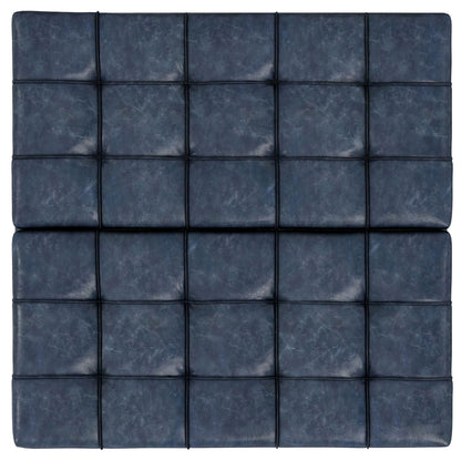 The Harrison Upholstered Coffee Table Storage Ottoman features blue padded leather with a modern grid pattern of black lines, giving it a stylish, tufted look.