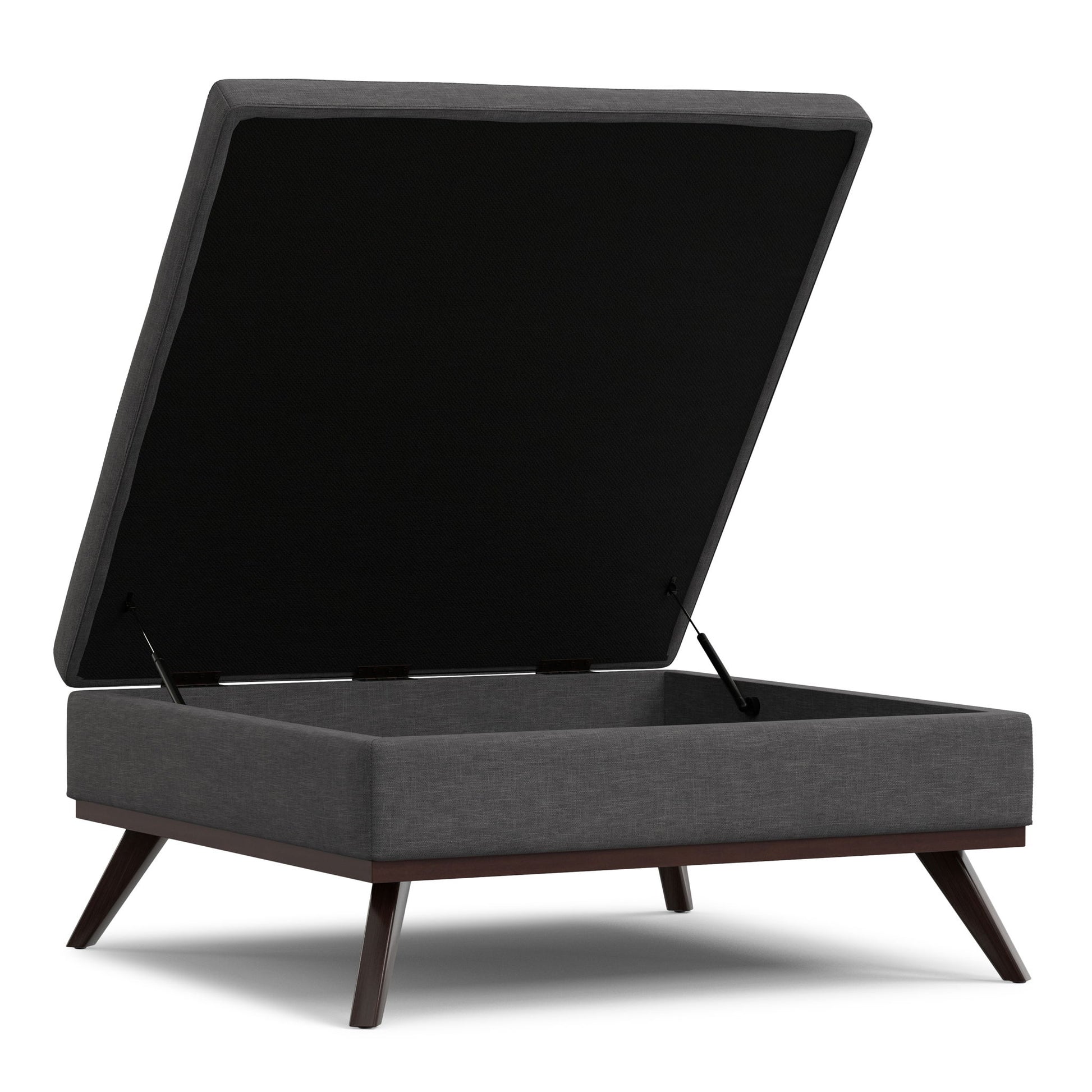 The Owen Multifunctional Square Coffee Table Storage Ottoman features dark fabric upholstery, angled wooden legs, and a hinged lid that opens to reveal roomy storage space inside.