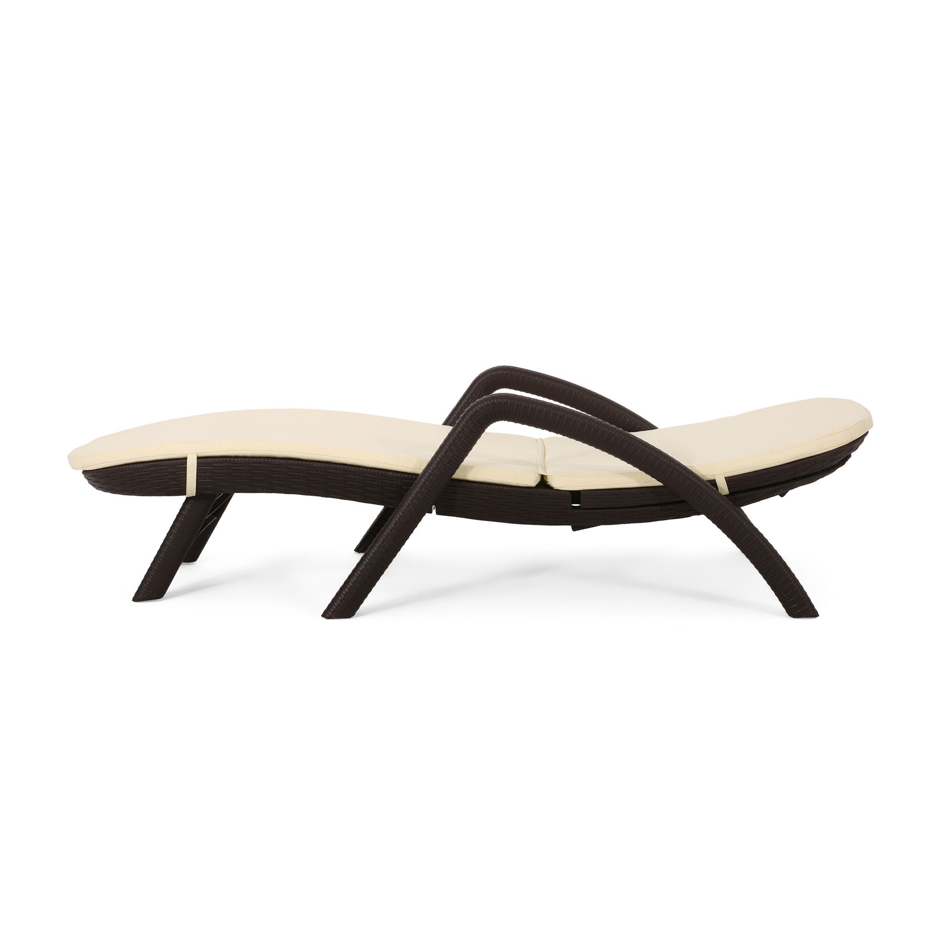 The Mikael - Chaise Lounge With Cushion features a modern dark brown wicker frame and a cream cushion, displayed in profile against a white background.