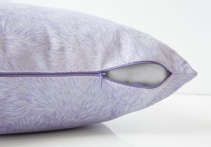 A close-up of the modern light purple Square Decorative Throw Pillow with insert included and hypoallergenic filling, showing a subtle textured pattern and a partially open zipper revealing the white inner material on a white surface.