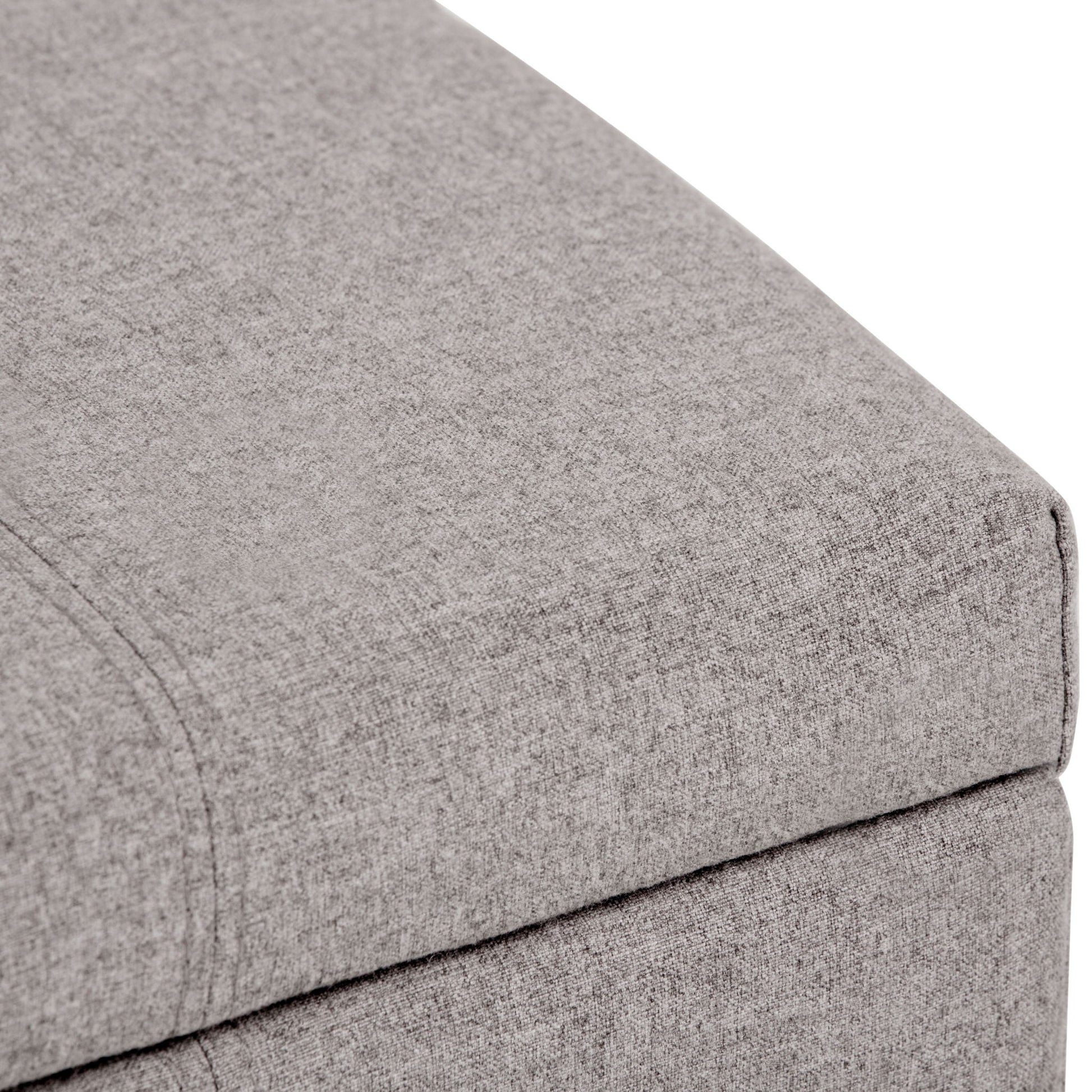 Close-up of the corner of the Dover - Upholstered Storage Ottoman Bench in light gray, highlighting its textured fabric and seam detail.