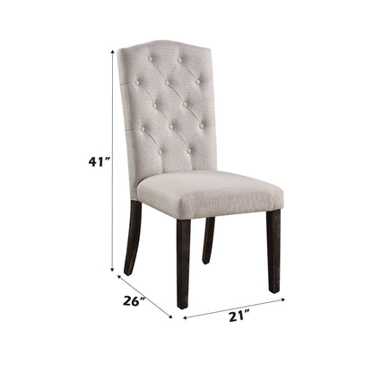The Gerardo - Linen Weathered Dining Chair (Set of 2) in Beige features a light beige tufted backrest, dark wooden legs, and measures 41" H x 26" D x 21" W.