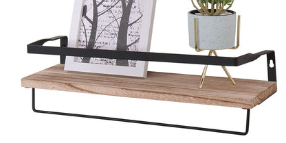 A set of two long floating wall shelves made of natural wood with brackets, perfect for bedrooms, shown holding a framed black-and-white tree print and a small potted plant.