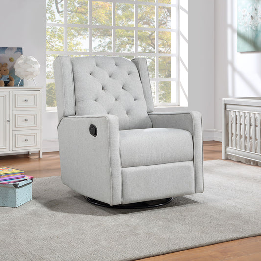 The Milah - Gliding Swivel Recliner Tufted in light gray sits on a gray rug in a bright, modern room with large windows, white furniture, and wooden floors.
