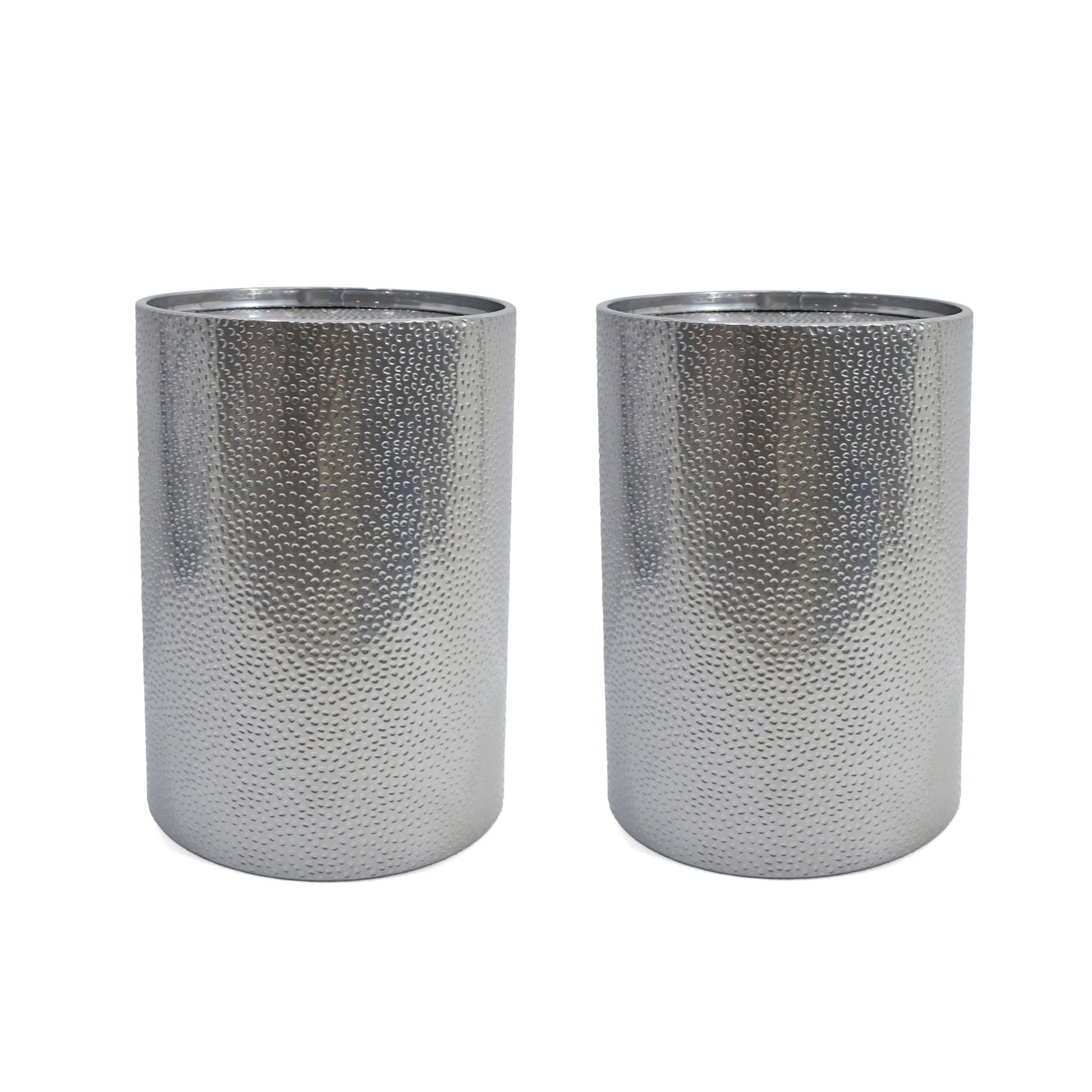 Two Modern Round Accent Tables with a silver hammered surface stand side by side on a white background.